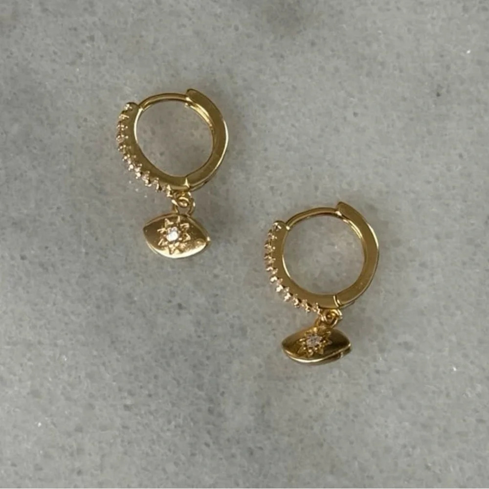 Gold Crystal Pave Evil Eye Star Burst Huggie Hoop Dangle Earrings 

Brand New
